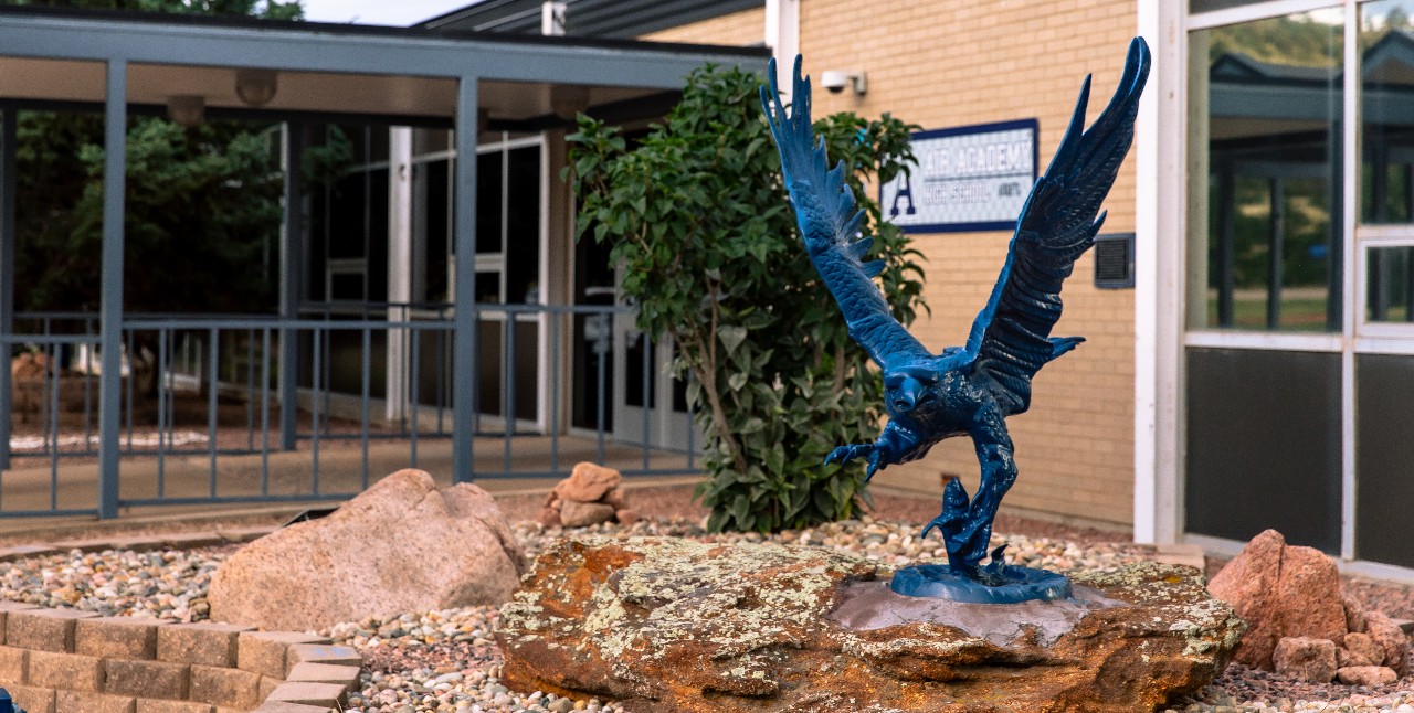 The falcon statue in front of Air Academy High School.